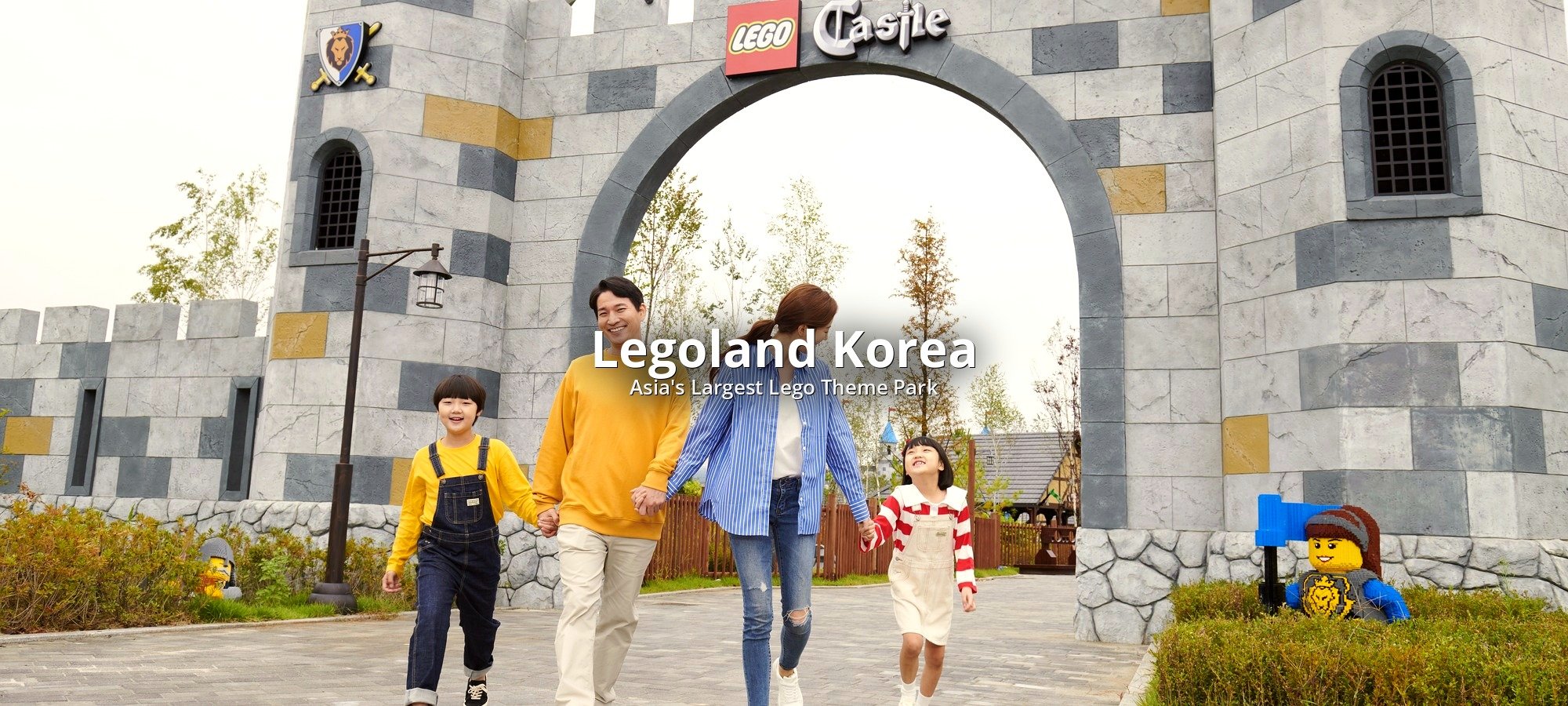 Legoland tour services and inclusions Tour bus with bilingual staff assisting guests at Legoland meeting point