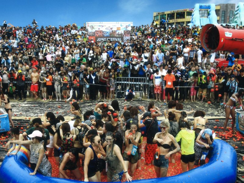 Boryeong Mud Festival Activities Festival-goers covered in mud at Boryeong Mud Festival