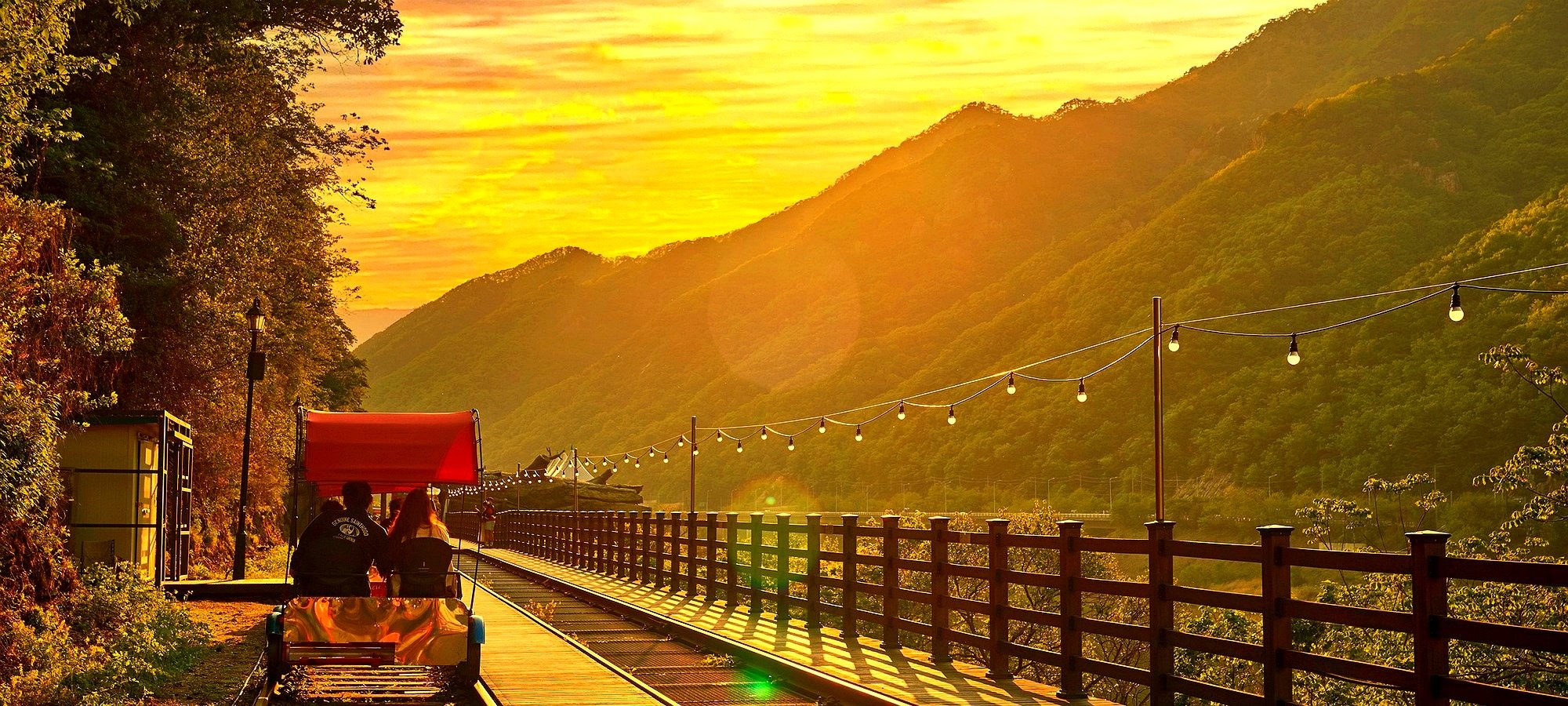 Services included in Alpaca World + Nami Island + Gangchon Railbike One Day Tour Tour bus with professional staff assisting travelers at Seoul pickup point